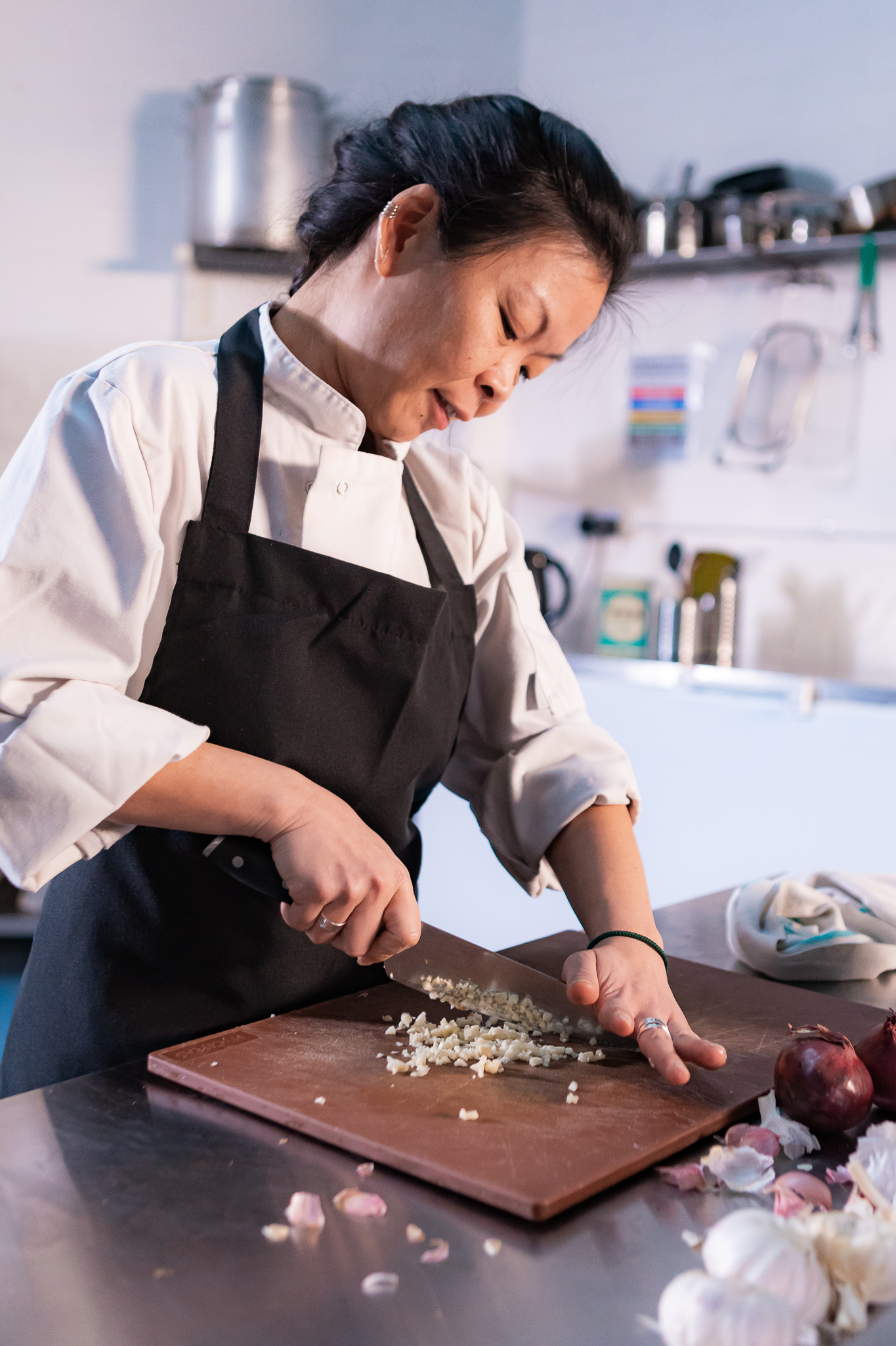 A chef frying food in a wok