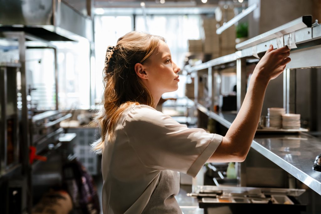 Closeup of cups and a brochure on a coffee table